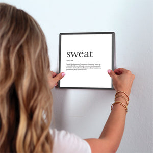 Definition of Sweat Slidetile on wall in office.