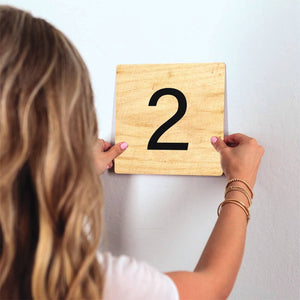 Number 2 - Light Wood Slidetile on wall in office.