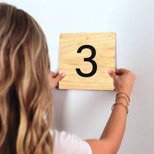 Number 3 - Light Wood Slidetile on wall in office.