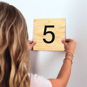 Number 5 - Light Wood Slidetile on wall in office.