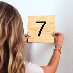Number 7 - Light Wood Slidetile on wall in office.
