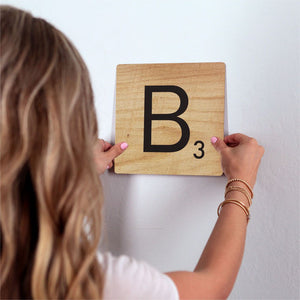 Letter B - Light Wood Slidetile on wall in office.