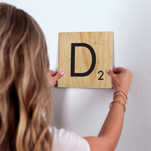 Letter D - Light Wood Slidetile on wall in office.