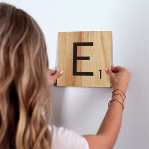 Letter E - Light Wood Slidetile on wall in office.