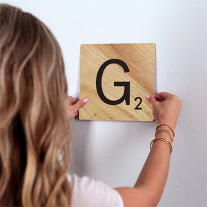 Letter G - Light Wood Slidetile on wall in office.