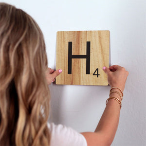 Letter H - Light Wood Slidetile on wall in office.