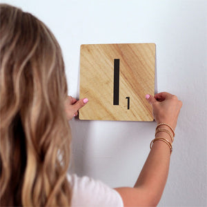 Letter I - Light Wood Slidetile on wall in office.