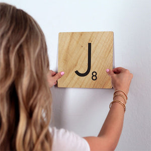 Letter J - Light Wood Slidetile on wall in office.