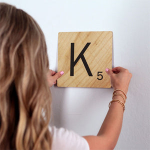 Letter K - Light Wood Slidetile on wall in office.
