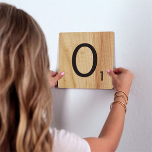 Letter O - Light Wood Slidetile on wall in office.