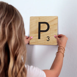 Letter P - Light Wood Slidetile on wall in office.