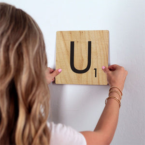 Letter U - Light Wood Slidetile on wall in office.
