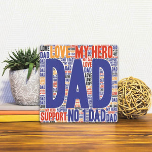A Slidetile of the Dad My Hero sitting on a table.