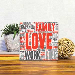 A Slidetile of the Love my Family sitting on a table.