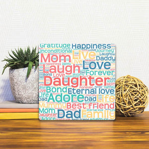 A Slidetile of the Love our Daughter sitting on a table.
