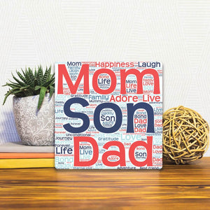 A Slidetile of the Love our Son sitting on a table.