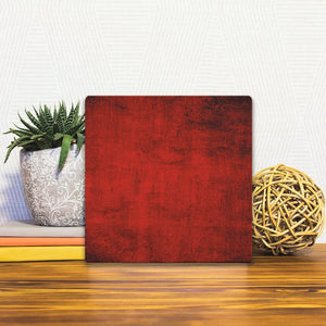 A Slidetile of the Deep Red sitting on a table.