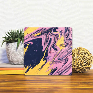 A Slidetile of the Purple and Yellow Swirls sitting on a table.