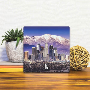 A Slidetile of the Los Angeles Skyline sitting on a table.