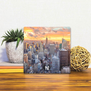 A Slidetile of the New York Skyline sitting on a table.