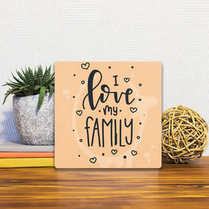 A Slidetile of the I love my family sitting on a table.