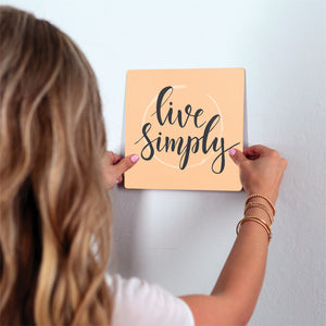 Live simply Slidetile on wall in office.
