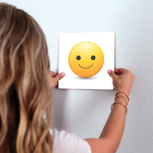 Happy Emoji Slidetile on wall in office.
