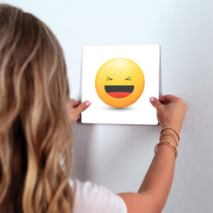 Laughing Emoji Slidetile on wall in office.