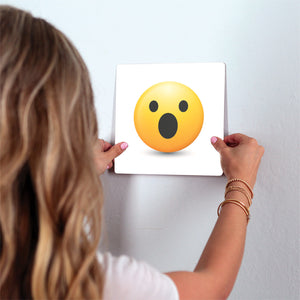 Shocked Emoji Slidetile on wall in office.