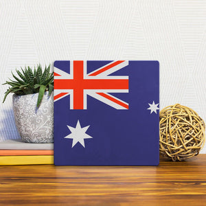 A Slidetile of the The Australian Flag sitting on a table.