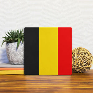 A Slidetile of the The Belgium Flag sitting on a table.