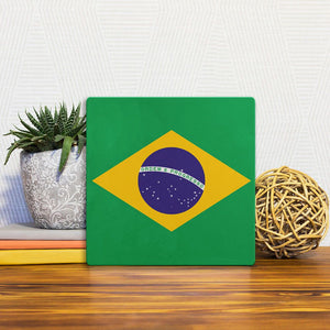 A Slidetile of the The Brazil Flag sitting on a table.