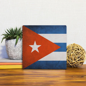 A Slidetile of the The Cuban Grunge Flag sitting on a table.