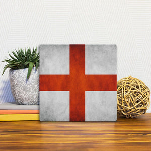 A Slidetile of the The English Grunge Flag sitting on a table.