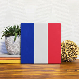 A Slidetile of the The French Flag sitting on a table.