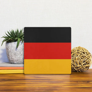 A Slidetile of the The German Flag sitting on a table.
