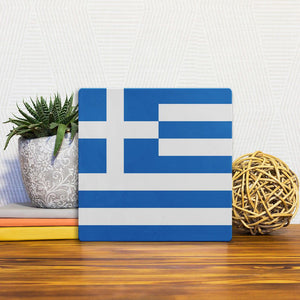 A Slidetile of the The Greek Flag sitting on a table.