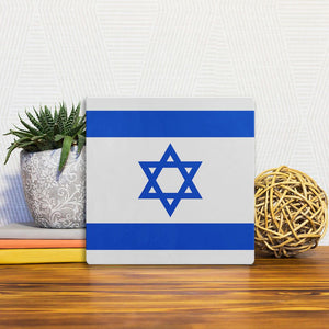A Slidetile of the The Israel Flag sitting on a table.
