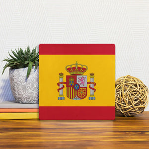 A Slidetile of the The Spanish Flag sitting on a table.