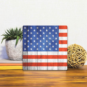 A Slidetile of the The American Flag on Wood sitting on a table.