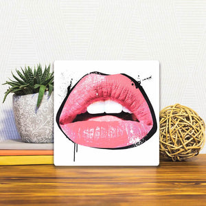 A Slidetile of the Bright Pink Lips sitting on a table.