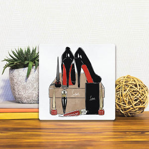 A Slidetile of the High Heeled Fashion sitting on a table.
