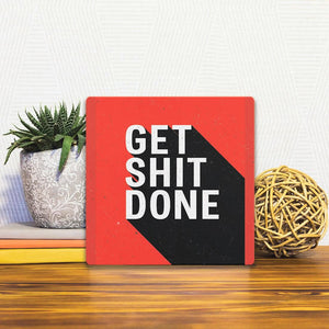 A Slidetile of the Get Shit Done sitting on a table.