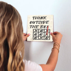 Always Think Outside the Box Slidetile on wall in office.