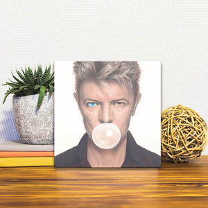 A Slidetile of the Bowie Blows a Bubble sitting on a table.