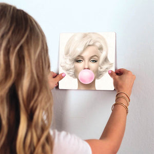 Monroe Blows a Bubble Slidetile on wall in office.