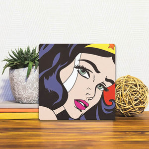 A Slidetile of the I am Wonder Woman sitting on a table.