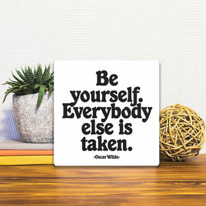 A Slidetile of the Oscar Wilde - Be yourself sitting on a table.
