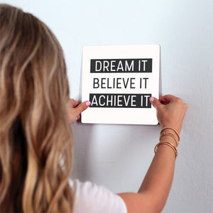Dream it. Believe it… Slidetile on wall in office.