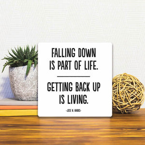 A Slidetile of the Getting back up is living… sitting on a table.